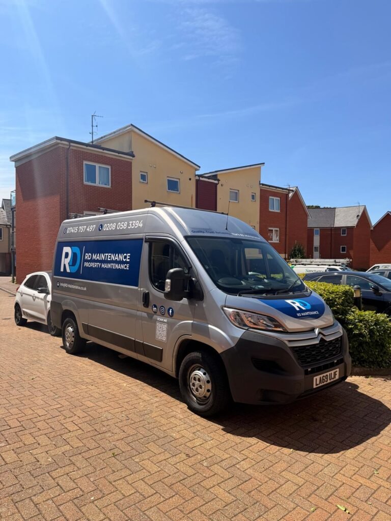 RD Maintenance liveried van parked outside a residential block