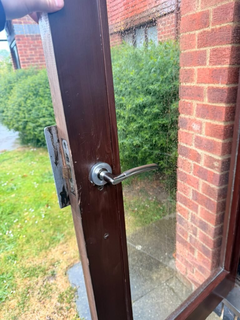 New door handle fitted to a timber door