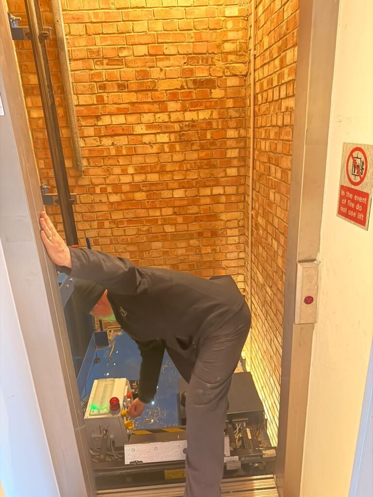 Decorator painting a communal stairwell