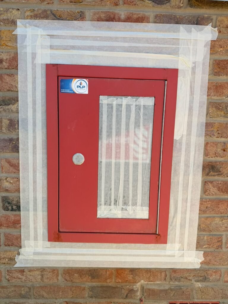 Red fire equipment cabinet on a communal building
