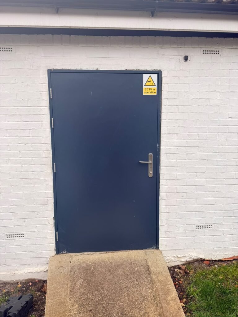 New steel door fitted to a building