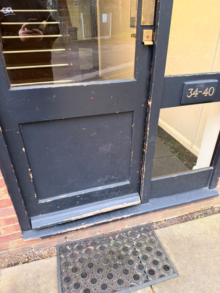 Communal entrance door panel repaired