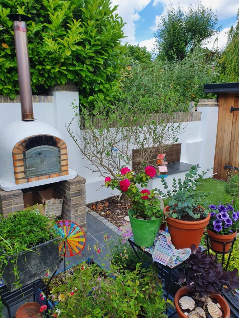 Freshly painted garden walls with pizza oven – RD Maintenance painting & decorating